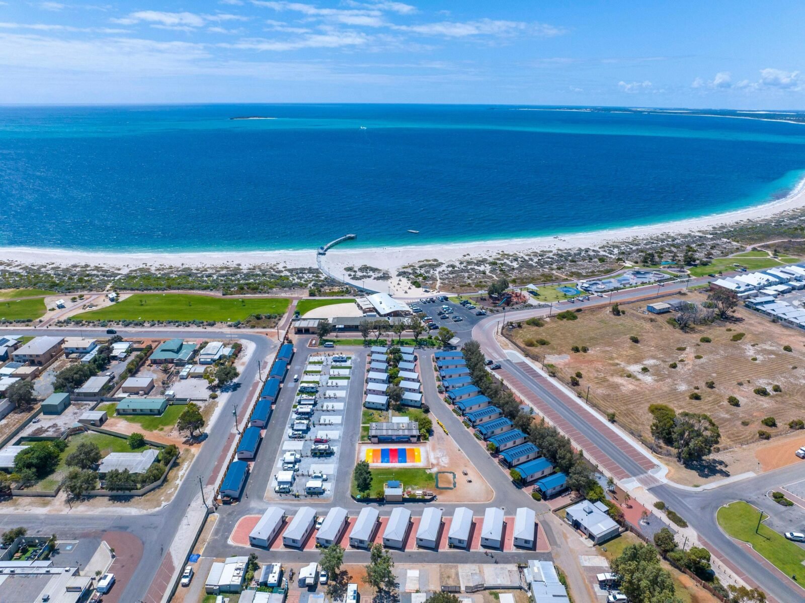 An aerial image shows Jurien Bay Tourist Park on the beach front in Jurien Bay