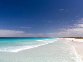 Bright blue ocean, blue skies and white sands.