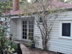 Serenity Cottage front aspect with views of our Heritage rose garden bed