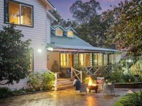 Serenity House Pemberton exterior, forest fringed gardens and fire pit for winter months