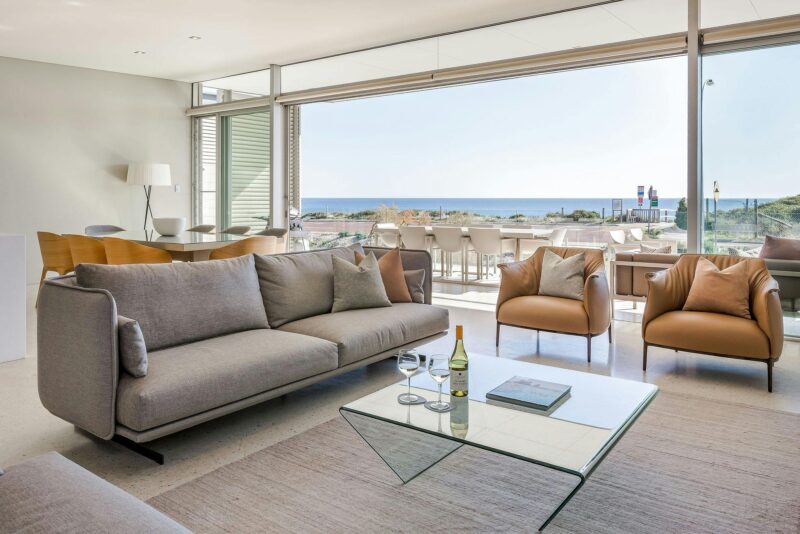 Lounge Room with balcony in background and view of the ocean