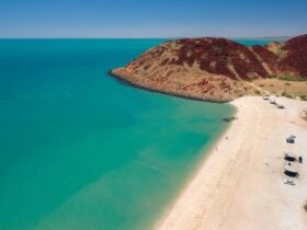 Aerial view of the Hearson Cove, near Karratha. Image shows cars on the beach, the water, and rocks