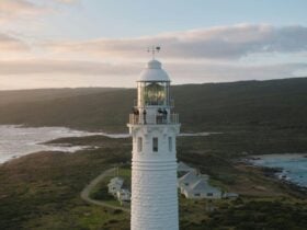 People stand on the balcony of Cape Leeuwin Lighthouse.