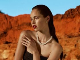 Our muse wears a timeless Australian South Sea pearl strand and studs, on a background of red.