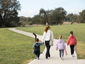 Family on nature and history walk at Lake Gwelup Story Trail