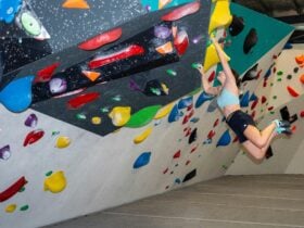 Female boulder dynamic climb
