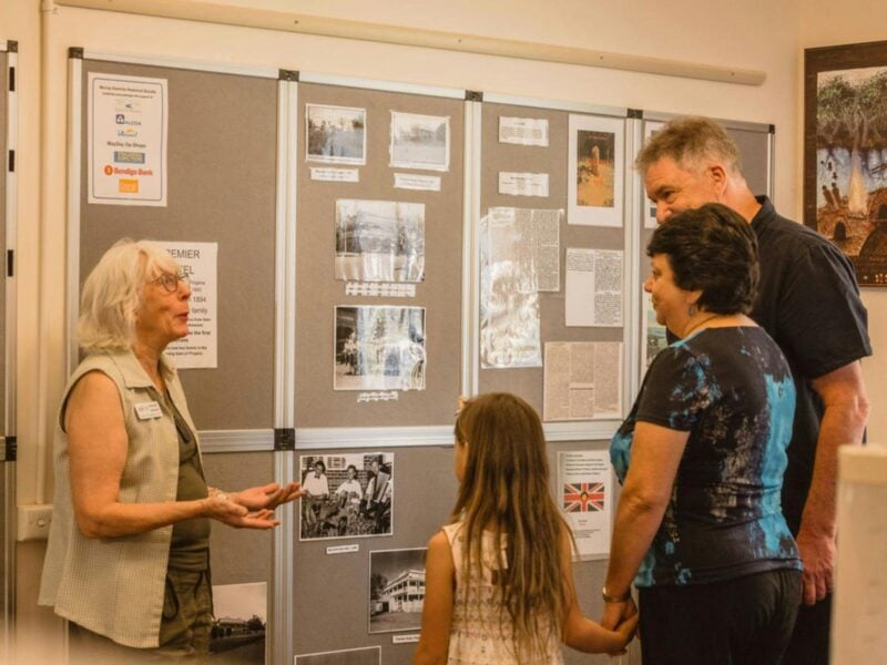 A member of the Murray Districts Historical Society speaks with people about Murray region history