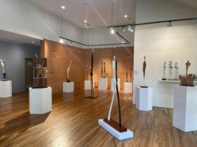 Art gallery featuring carved wooden sculptures