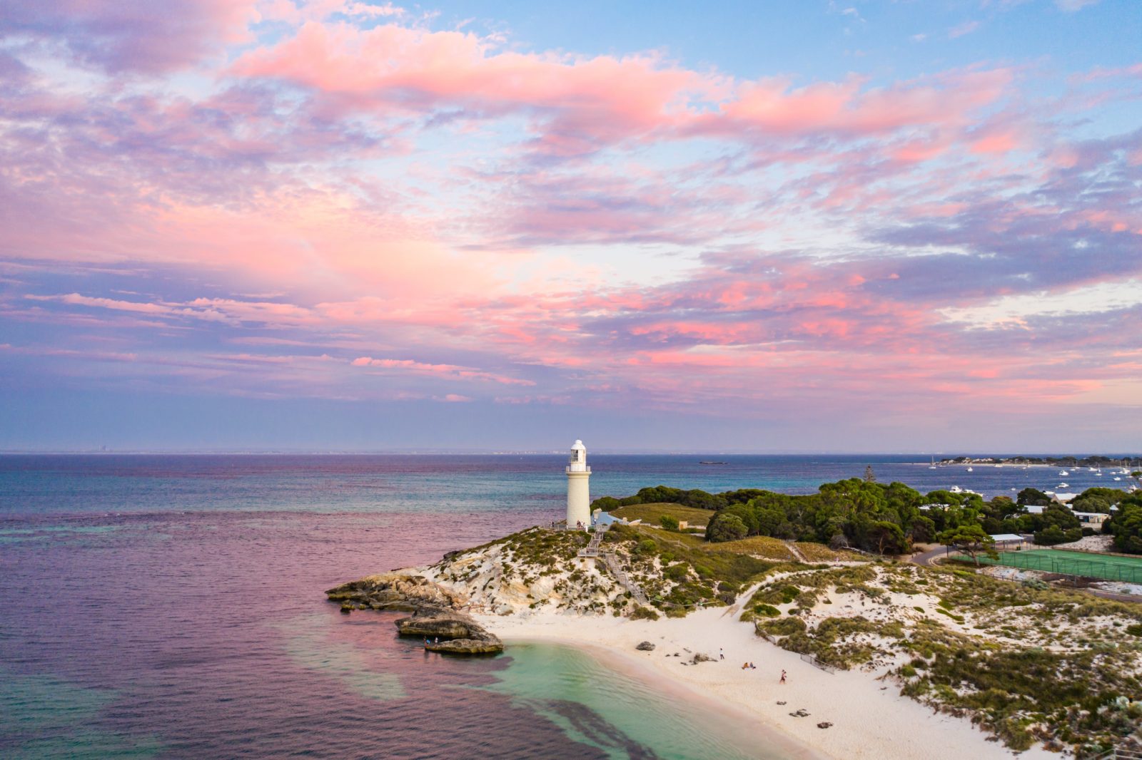 View of the lighthouse and headland at sunset.