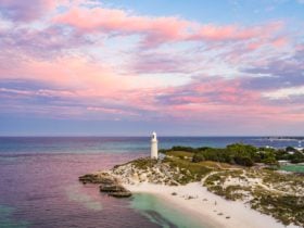 View of the lighthouse and headland at sunset.