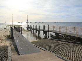 Wooden jetty leading out to the ocean.