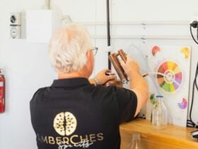 Master distiller demonstrating a copper still during a gin distilling class