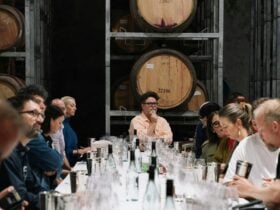 Howard Park Global Sparkling Tasting, long table amongst the barrel room with guest tasting wine