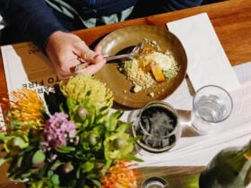 Metricup's FIRESIDE FEAST at Beerfarm, well presented plate on a table next to a beer and flowers