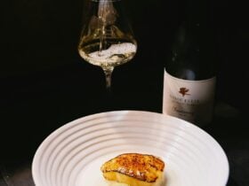Vasse Felix X Odette, a glass of Vasse Felix Chardonnay next to it's bottle behind a plated meal