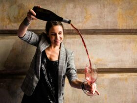 Emma pouring wine