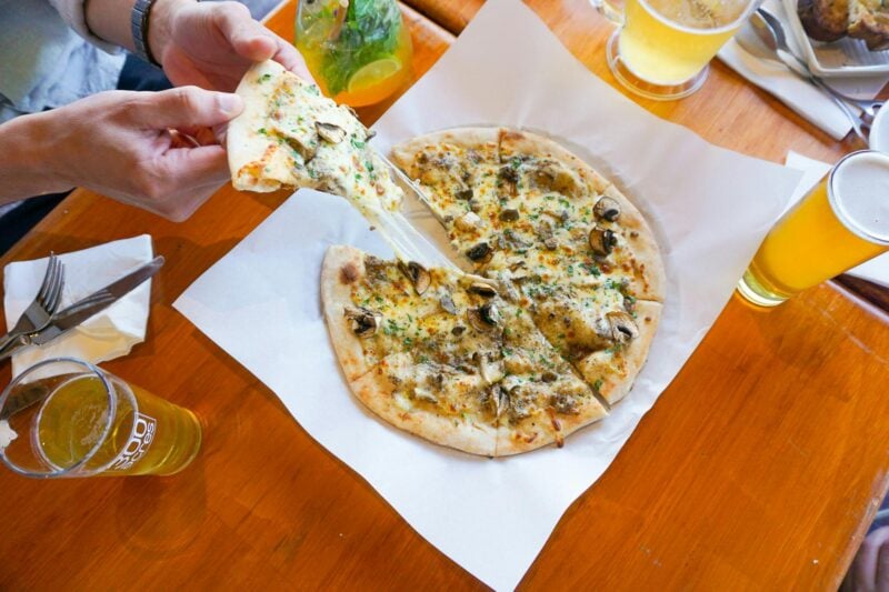 Pizza with cheese at 300 Acres restaurant Wembley Golf Course Perth, served with a cold beer