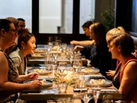 Friends chatting over wine and food