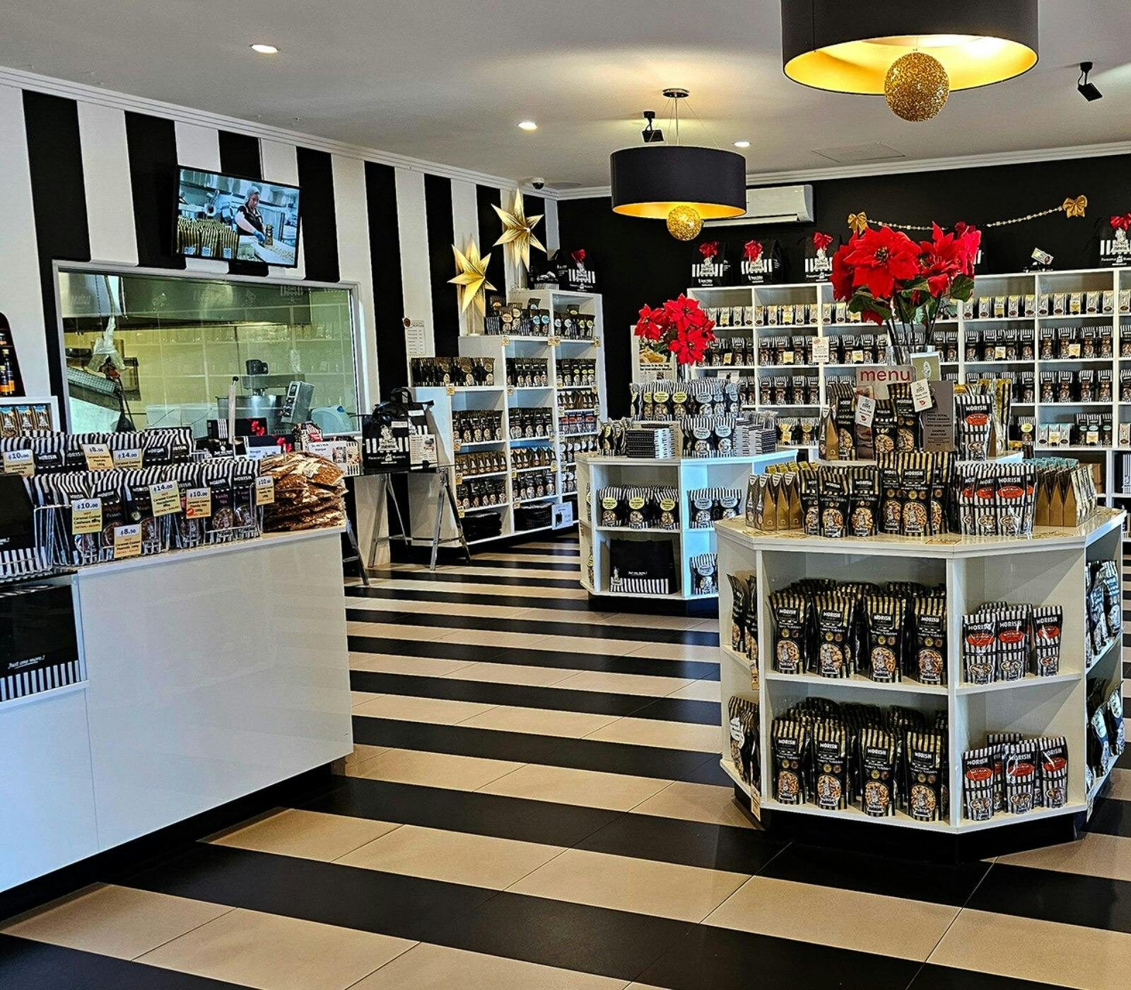 Morish Nuts shop decorated in black and white with viewing window