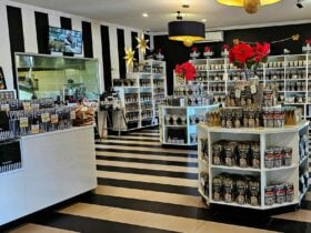 Morish Nuts shop decorated in black and white with viewing window