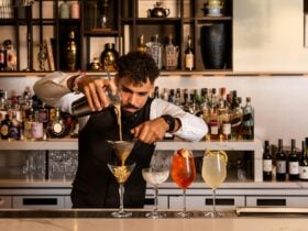 Bartender straining a cocktail