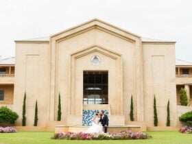 Wedding couple out front of Abbey Beach Resort