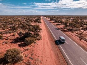 Home on the Road rental campervan driving along a highway in Western Australia
