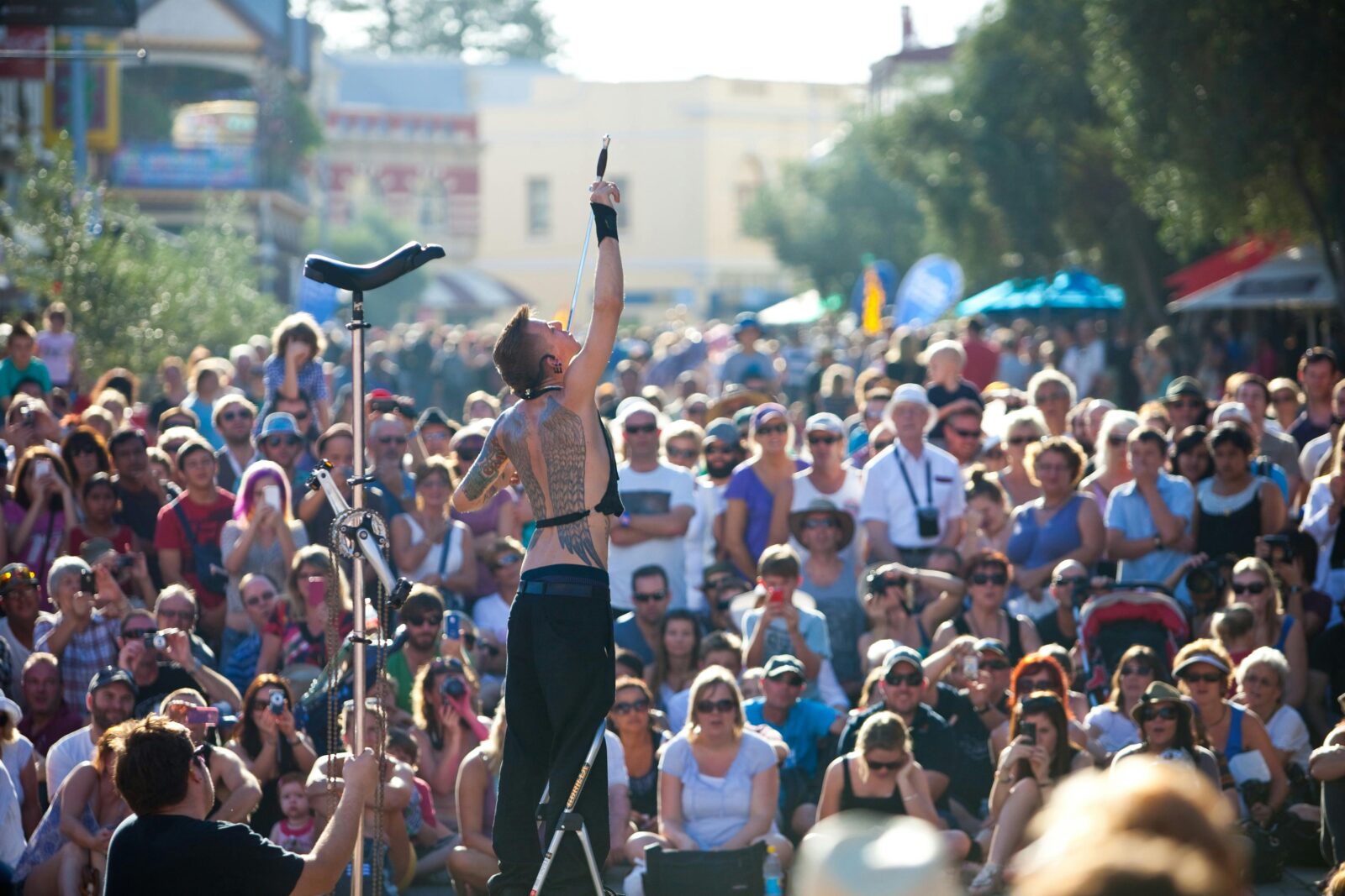 Street performer surrounded by crowds