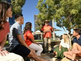 Photo features Principal Guide, Walter McGuire with a group of tourists