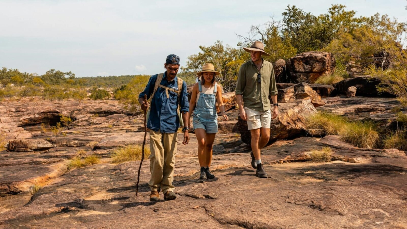 Guide and guests walking starting the walk back down from the top of the Mitchell Falls