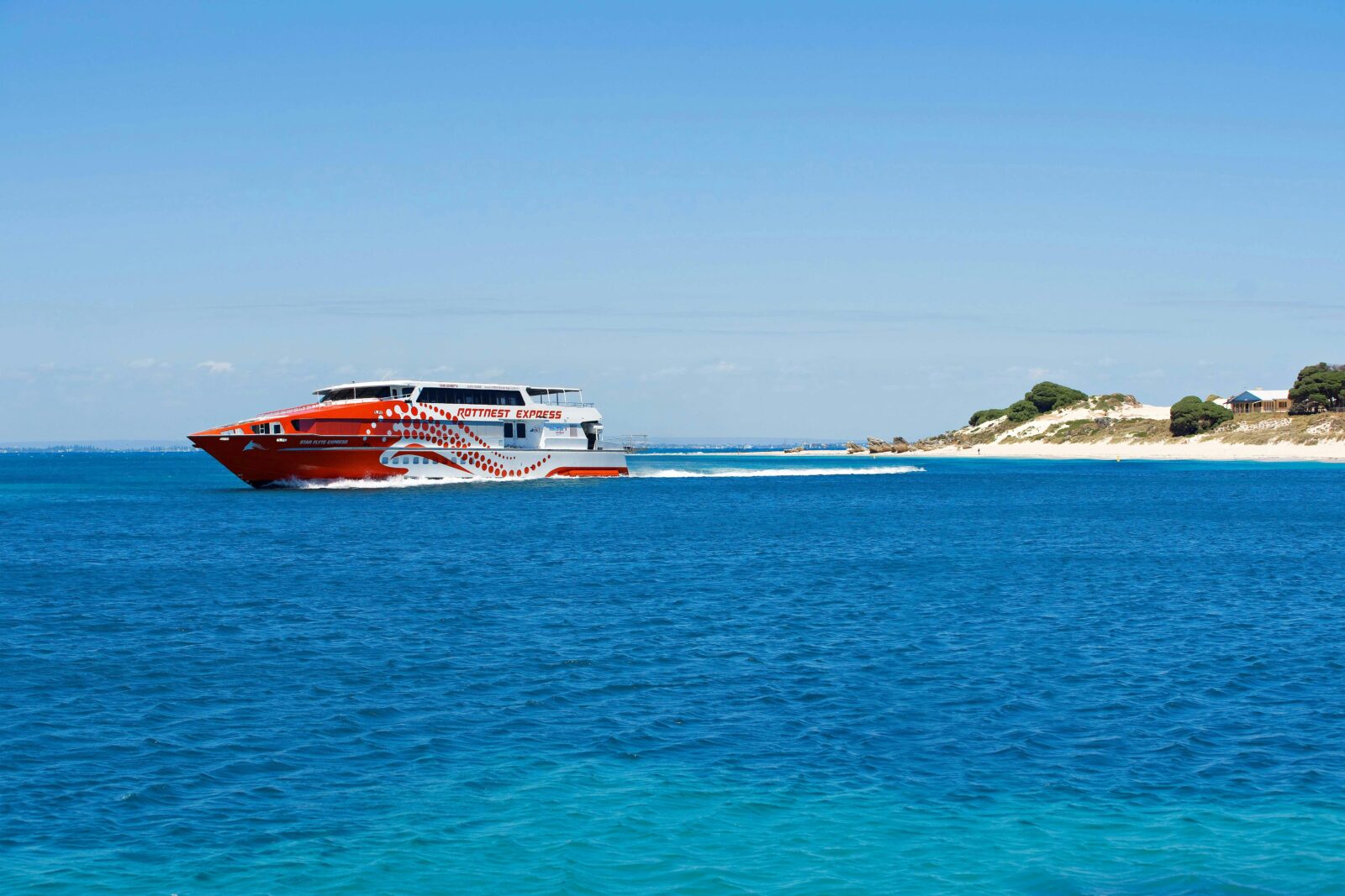 A ferry cruises past Rottnest Island