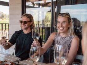 A man and woman at a wine tasting.